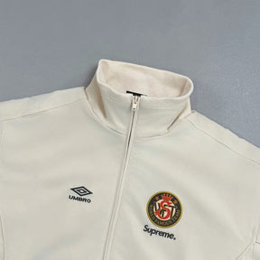 Conjunto Supreme x Umbro Cotton Ripstop Track Stone