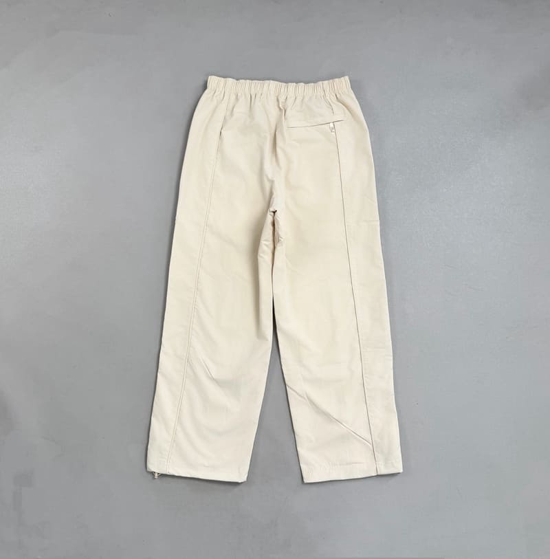 Conjunto Supreme x Umbro Cotton Ripstop Track Stone